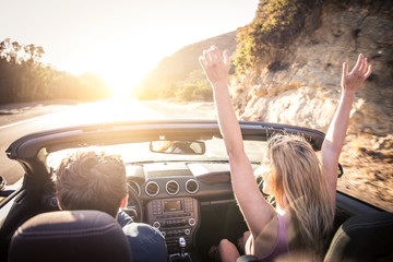 Couple on convertible car