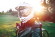 close up portrait of Biker Man in white dual sport helmet, Adventure Motorcycle, off road travel concept, enduro rider equipment, extreme lifestyle, rady to ride