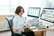 © puhhha - Woman Designer Working On Computer In Office