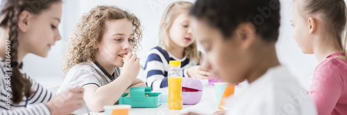Panorama Of School Kids Eating Lunch Together During A Break At A