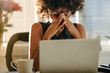 © Jacob Lund - Stressed businesswoman sitting at desk
