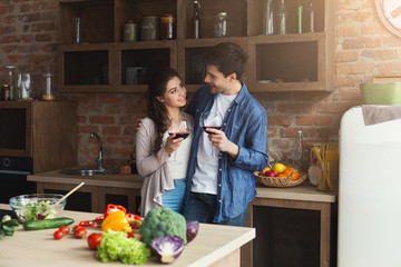 Happy couple cooking healthy food together