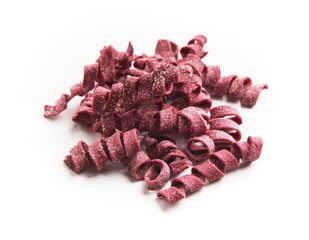 Wall Mural - Pile of raw purple fusilli isolated on white