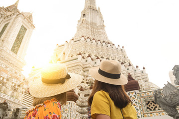Wall Mural - Tourists are traveling and sightseeing at Wat Arun temple in Bangkok during holiday summer vacation time.
