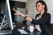 © bnenin - Angry female boss pointing at computer screen.