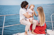 © alfa27 - Outdoor portrait of happy family with 4-year old daughter on sailing boat at sunny summer day. European parents playing with kid on a bow of luxury yacht. Family, Marine Cruise and people concept