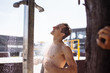 © alfa27 - Healthy athletic young half-naked male taking outdoor shower after swimming, refreshing himself before playing beach volleyball with his friends.