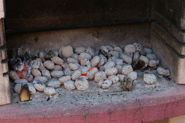 Hot coals in the grill oven