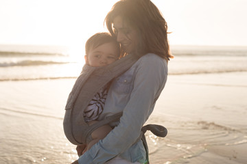 Wall Mural - Mother carrying baby