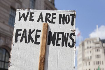 We are not fake news political banner at a protest march