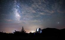Open Dome Of A Big Telescope In An Observatory In The Background Of The Starry Sky
