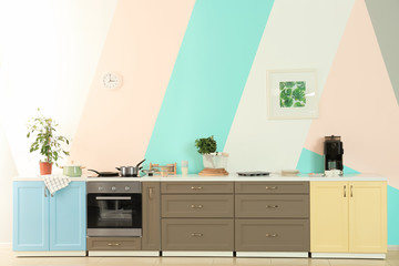 Sticker - Modern kitchen furniture on color wall background