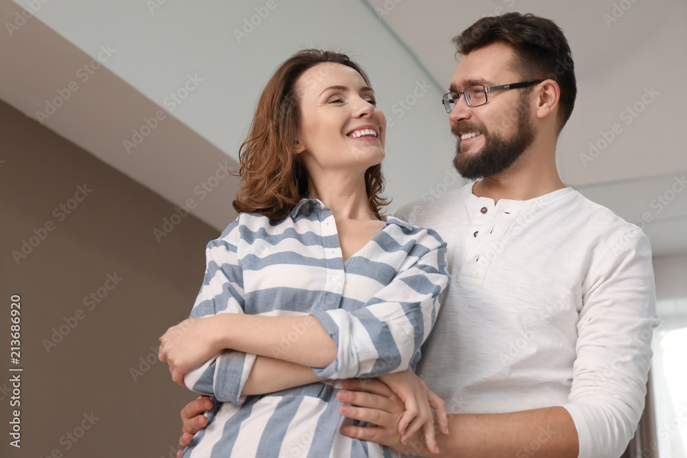 Lovely couple dancing together at home