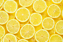 A Slices Of Fresh Juicy Yellow Lemons.  Texture Background, Pattern.