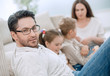 © ASDF - close up.parents play with their children sitting on the couch