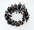 © ASDF - concept of team building .large successful business team sitting in a circle