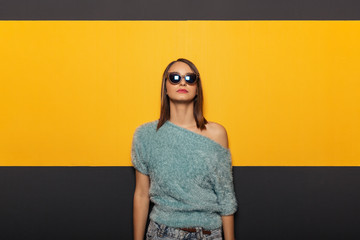 Wall Mural - Fashion portrait of an appealing, stylish woman with sunglasses