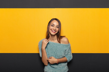 Wall Mural - Pretty young lady fooling around in studio