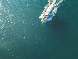 Poster - aerial of peple relax and sun tanning in the fast motor boat top view in the summer sea