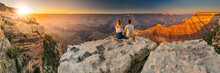 A Man And A Woman Sit At The Edge Of The Grand Canyon At Sunset Minutes