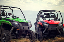 Friends Driving Off-road With Quad Bike Or ATV And UTV Vehicles