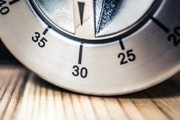 Wall Mural - 30 Minutes - Macro Of An Analog Chrome Kitchen Timer On Wooden Table