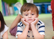 © weedezign - Boy kid lay down on library floor with bored feeling in preschool library,Kindergarten school education concept.