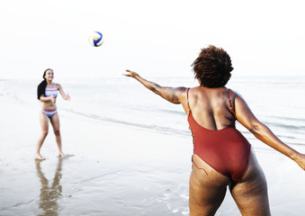 Friends playing volleyball