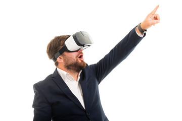 Wall Mural - Staring business man wearing vr goggles and pointing up.