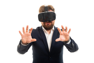 Wall Mural - Business man wearing vr goggles doing hands gesture.