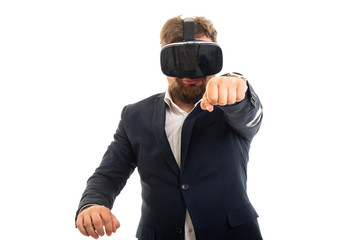Wall Mural - Portrait of business man wearing vr goggles and showing fist.