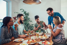 Group Of Multiethnic Friends Enjoying Dinner Party