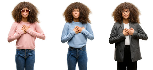 Canvas Print - African american young woman wearing different outfits smiling with hands on chest with closed eyes and grateful gesture on face. Health concept.