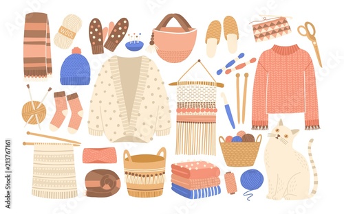 Fotomural Collection of winter knitted clothes and knitting tools isolated on white background - woolen jumper, cardigan, scarf, hat, mittens, socks, needles, hook, yarn