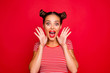 WOW! Portrait of astonished surprised girl with wide open mouth eyes gesturing with palms near face isolated on red background