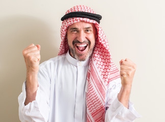 Senior arabic man screaming proud and celebrating victory and success very excited, cheering emotion