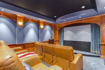 Wall Mural - Blue movie room with leather chairs