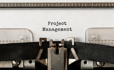 Poster - text project management typed on retro typewriter