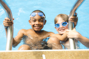 children in outside swimming pool