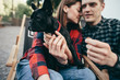 Loving couple with pet french bulldog