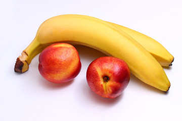 Poster - nectarine and bananas on a white background