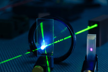 Green Laser On Optical Table In A Quantum Optics Lab.