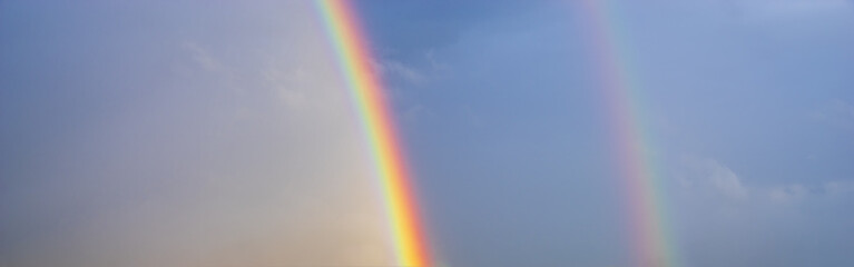 Wall Mural - double, beautiful, multi-colored rainbow after passing a spring downpour