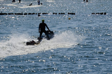 SAFETY ON HOLIDAYS - The Water Rescuer Patrols Sea Shore On A Jet Ski