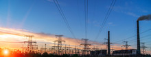 Distribution Electric Substation With Power Lines And Transformers, At Sunset