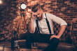 © deagreez - Overworked bad mood regret disappointment exhausted chill handover headache suffer lonely lost concept. Sad upset unhappy tired frustrated troubled pensive serious guy analyzing his fail in business