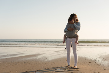 Wall Mural - Mother carrying baby