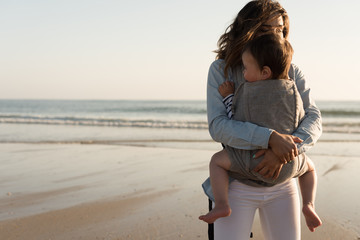 Wall Mural - mother carrying baby