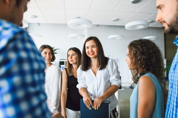 Wall Mural - business lady holds a meeting with colleagues in the office