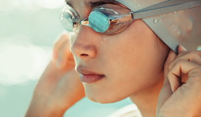 Wall Mural - Professional swimming athlete in cap and goggles